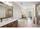 Elegant bathroom featuring dual sinks, soaking tub, and glass shower at 2172 Peach Se Ln, Smyrna, GA 30080