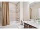 Bathroom featuring shower-tub combo, modern fixtures, and neutral decor at 2172 Peach Se Ln, Smyrna, GA 30080