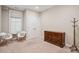 Bright bedroom with neutral carpet, closet, dresser, chairs, and a light-filtering window at 2172 Peach Se Ln, Smyrna, GA 30080