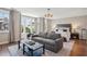 Bright bedroom featuring a sitting area with a sofa, and a large window at 2172 Peach Se Ln, Smyrna, GA 30080
