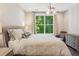 Comfortable bedroom with patterned bedding and a view of lush greenery at 2172 Peach Se Ln, Smyrna, GA 30080
