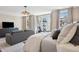 Bright bedroom featuring a sitting area with a sofa, and a large window at 2172 Peach Se Ln, Smyrna, GA 30080
