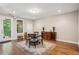 Bright dining room with hardwood floors and a view to a outdoor space at 2172 Peach Se Ln, Smyrna, GA 30080