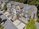 Modern townhome exterior featuring brick facade, large windows, and private garage at 2172 Peach Se Ln, Smyrna, GA 30080