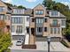 A well-manicured townhome with brick and painted exterior, a welcoming entrance and attached garage at 2172 Peach Se Ln, Smyrna, GA 30080