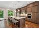 Beautiful kitchen with wood cabinets, granite countertops, stainless steel appliances, and a large island with seating at 2172 Peach Se Ln, Smyrna, GA 30080