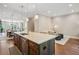 Spacious kitchen island, hardwood floors and lighting fixtures at 2172 Peach Se Ln, Smyrna, GA 30080