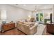 Cozy living room with hardwood floors, decorative lighting, comfortable seating, and access to outdoor area at 2172 Peach Se Ln, Smyrna, GA 30080