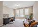 Bright home office with large windows, a desk, and comfortable seating area at 2172 Peach Se Ln, Smyrna, GA 30080