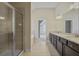 Modern bathroom with a glass shower, double sink vanity, and granite countertops at 3204 Ivy Farm Path, Buford, GA 30519