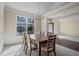 Dining room featuring wainscoting, and modern lighting fixtures providing an inviting and well-lit space at 3204 Ivy Farm Path, Buford, GA 30519