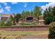 The Village at Ivy Creek entrance sign, beautifully landscaped with flowers and greenery at 3204 Ivy Farm Path, Buford, GA 30519