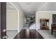 Elegant foyer with hardwood floors, staircase, and decorative molding offering a view into other rooms at 3204 Ivy Farm Path, Buford, GA 30519