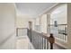 Upstairs hallway with rod iron railing overlooking the lower level at 3204 Ivy Farm Path, Buford, GA 30519