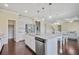 Gourmet kitchen flows seamlessly into the living spaces, perfect for entertaining Gathering and friends at 3204 Ivy Farm Path, Buford, GA 30519