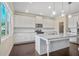 Modern white kitchen with subway tile backsplash, granite countertops, and stainless steel appliances at 3204 Ivy Farm Path, Buford, GA 30519
