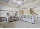 Bright open-concept living room featuring a decorative ceiling and neutral color palette at 3204 Ivy Farm Path, Buford, GA 30519