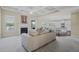 Bright living room with fireplace, large windows, and open layout with access to the kitchen at 3204 Ivy Farm Path, Buford, GA 30519