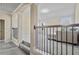 Well-lit living room with carpeted floors, staircase, and neutral walls, offering a comfortable space at 3204 Ivy Farm Path, Buford, GA 30519