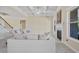 Cozy living room with a fireplace and large windows offering ample natural light at 3204 Ivy Farm Path, Buford, GA 30519