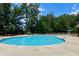 Enjoy the community pool surrounded by lush greenery and comfortable lounge chairs at 3204 Ivy Farm Path, Buford, GA 30519
