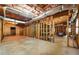 Unfinished basement with exposed framing, a concrete floor, and unfinished ceiling at 418 Whisper Wood Way, Locust Grove, GA 30248