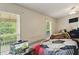 Bright bedroom with two windows offering natural light, features twin beds and a cozy atmosphere at 418 Whisper Wood Way, Locust Grove, GA 30248
