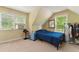 Comfortable bedroom with natural light, features a single bed, window AC unit, and carpeted flooring at 418 Whisper Wood Way, Locust Grove, GA 30248