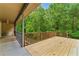 Spacious wooden deck with railings, perfect for enjoying the nature views at 418 Whisper Wood Way, Locust Grove, GA 30248