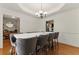 Dining room with table set for eight and hardwood floors at 418 Whisper Wood Way, Locust Grove, GA 30248