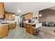 Open kitchen features an island with seating and stainless appliances at 418 Whisper Wood Way, Locust Grove, GA 30248