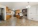 View of kitchen with island, stainless appliances and barstool seating at 418 Whisper Wood Way, Locust Grove, GA 30248