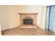 Living room featuring a brick fireplace and wood-look flooring at 3800 Travis Trce, Decatur, GA 30032