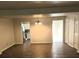 Spacious living room featuring modern flooring and updated lighting fixtures at 3800 Travis Trce, Decatur, GA 30032