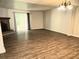 Bright living area with wood-look flooring, fireplace, and sliding glass door at 3800 Travis Trce, Decatur, GA 30032