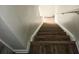 Staircase with wood-look steps and painted walls at 3800 Travis Trce, Decatur, GA 30032