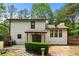 Exterior view of the back of the home with an inviting covered patio and spacious yard at 466 Victoria Rd, Woodstock, GA 30189