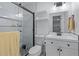 Modern bathroom features a glass shower, sleek vanity, and neutral tiling at 466 Victoria Rd, Woodstock, GA 30189