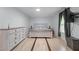 Well-lit bedroom featuring a dresser, stylish bed, light wood floors, and plenty of natural light at 466 Victoria Rd, Woodstock, GA 30189