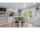 Cozy dining area with hardwood floors and a stylish table, steps from the living room, perfect for enjoying meals at 466 Victoria Rd, Woodstock, GA 30189