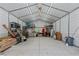Interior view of a metal detached garage with ample storage and a small window at 466 Victoria Rd, Woodstock, GA 30189