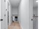 Bright hall leads to living space with modern fireplace feature at 466 Victoria Rd, Woodstock, GA 30189