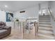 Open-concept living room features hardwood floors and a seamless transition to the modern kitchen at 466 Victoria Rd, Woodstock, GA 30189