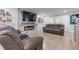 Modern living room features a sleek fireplace, recessed lighting, hardwood floors, and comfortable seating for relaxation at 466 Victoria Rd, Woodstock, GA 30189