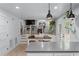 Bright living space features modern kitchen, dining area, fireplace, and sliding door access to exterior at 466 Victoria Rd, Woodstock, GA 30189