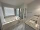 Bathroom with soaker tub, shower and double vanity at 525 Dunagan Dr, Lawrenceville, GA 30045