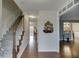 Inviting entryway features hardwood floors, staircase, and an open view into the formal living room at 525 Dunagan Dr, Lawrenceville, GA 30045