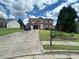 Charming brick home with a two-car garage, manicured lawn, and a neatly maintained front yard at 525 Dunagan Dr, Lawrenceville, GA 30045