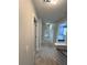 Upstairs hallway with neutral walls and carpet at 525 Dunagan Dr, Lawrenceville, GA 30045