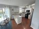 Modern kitchen features granite countertops, white cabinetry, stainless steel appliances, and a breakfast area at 525 Dunagan Dr, Lawrenceville, GA 30045